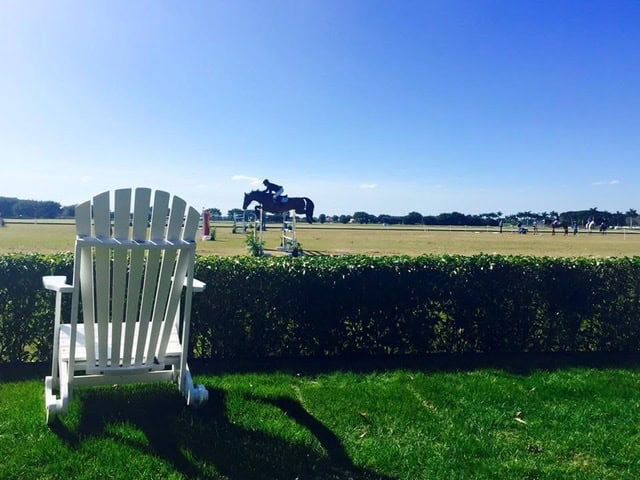 White Adirondack chair on lawn